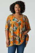Top péplum manches courtes motif tropical taille 54