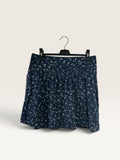 Jupe courte légère et fluide à fleurs bleues taille 14 ans